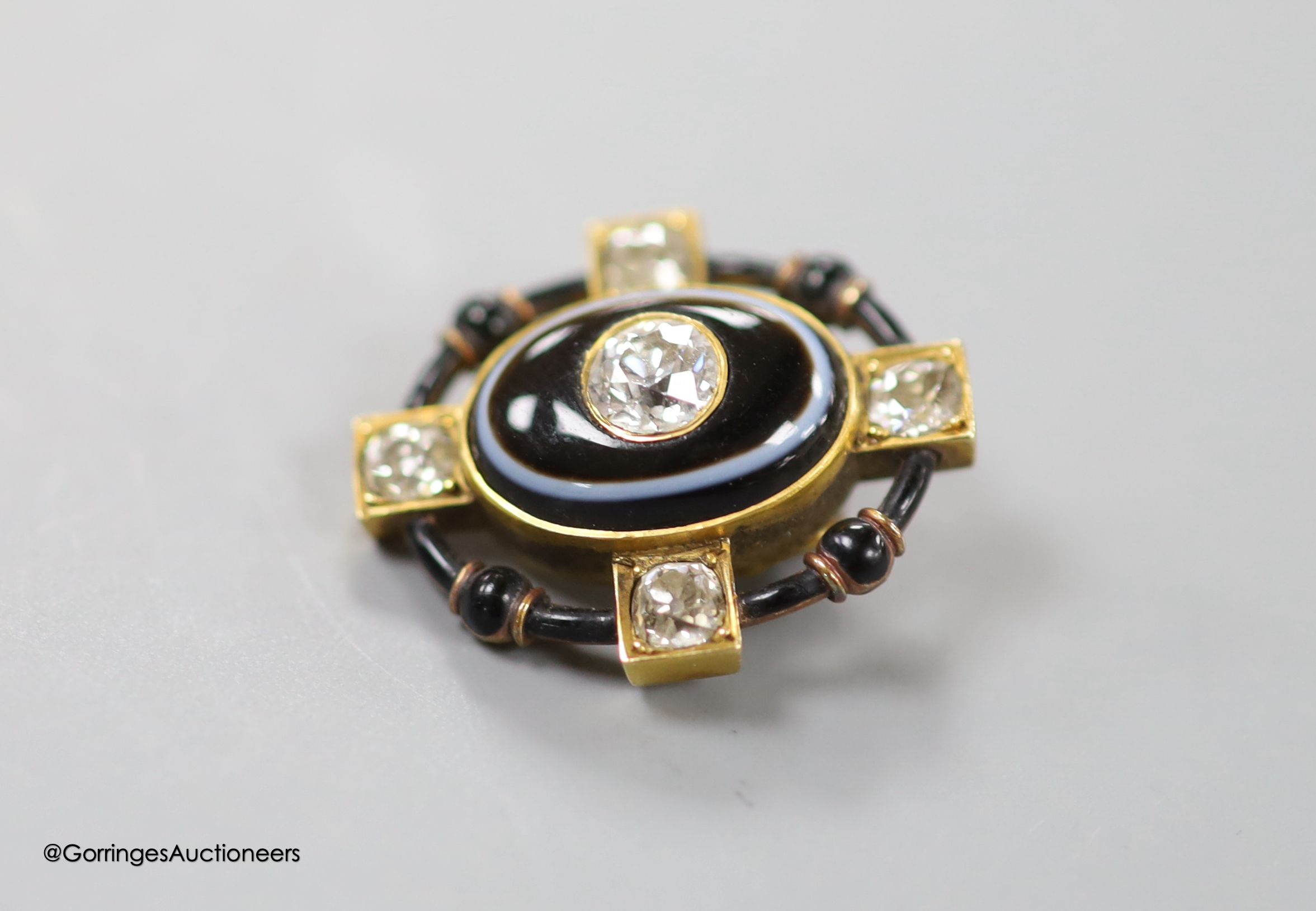 A Victorian yellow metal, banded agate, diamond and black enamel set mourning stick pin head, (no pin), 21mm, gross weight 4.7 grams